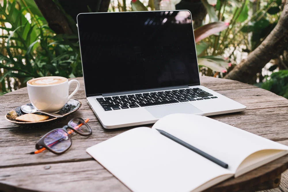 laptop with notebook